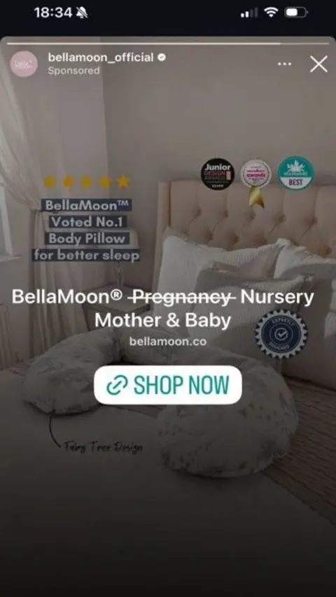 Irene Breen A screenshot of an advert on Instagram showing a body pillow on a bed, with text over it reading "Bella Moon Pregnancy Nursery Mother & Baby", with the word "Pregnancy" crossed out.